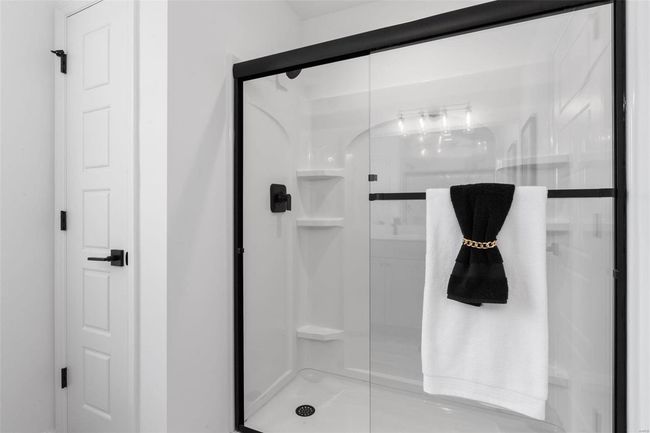 Bathroom with a shower with door | Image 13