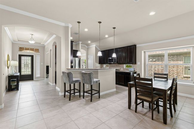 Open kitchen with eat in breakfast area | Image 6