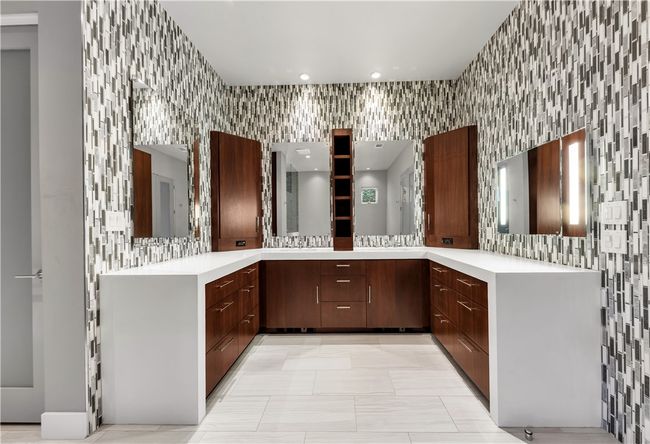 Full bathroom featuring vanity, tile walls, recessed lighting, and wallpapered walls | Image 28