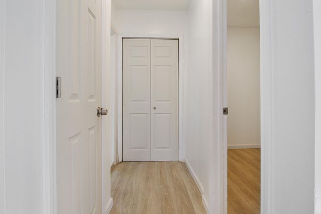 Hall featuring light wood finished floors and baseboards | Image 26