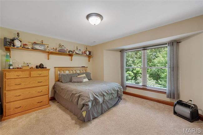 Bedroom with light colored carpet and baseboards | Image 37