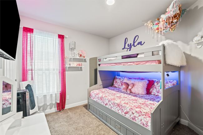 Bedroom with baseboards, carpet floors, and multiple windows | Image 21