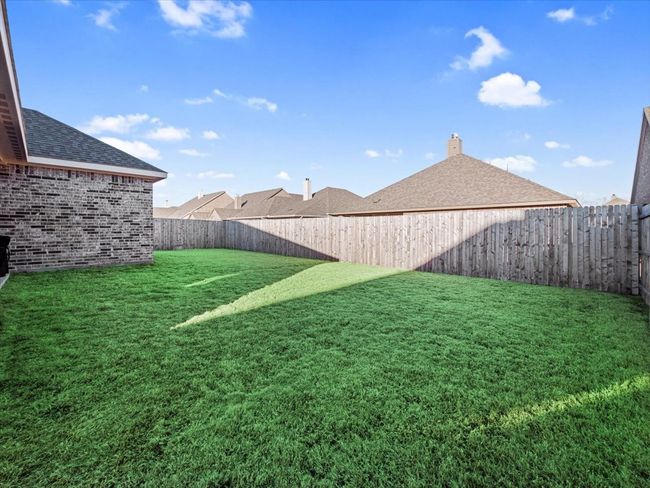 View of yard with a fenced backyard | Image 24