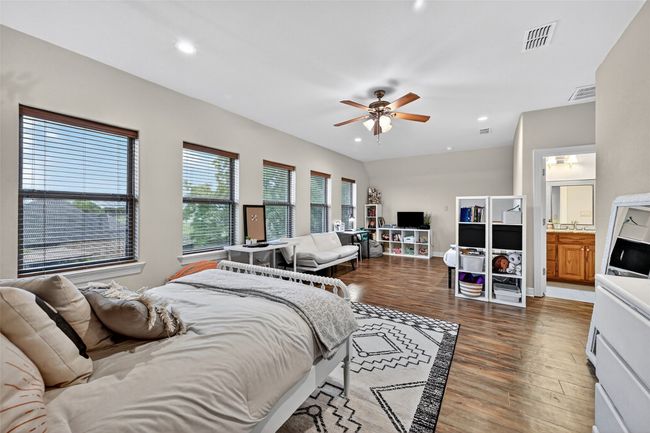 Bedroom featuring wood finished floors and recessed lighting | Image 29