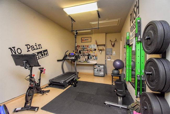 The third car tandem garage offers stroage space or other options. It includes a work bench and peg board wall! | Image 49