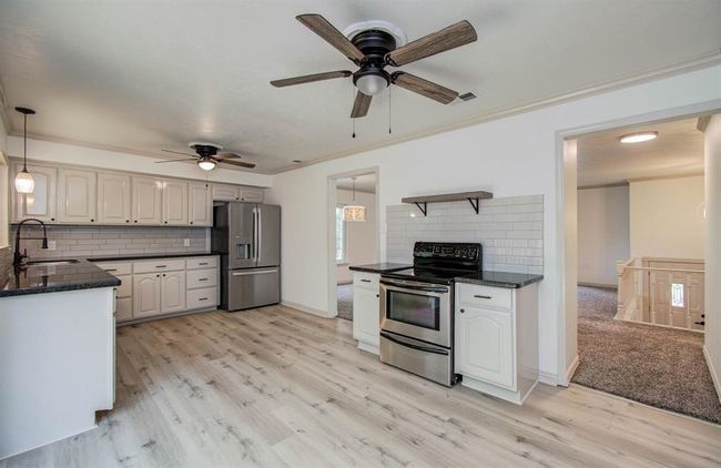 Stainless steel appliances in kitchen. | Image 17
