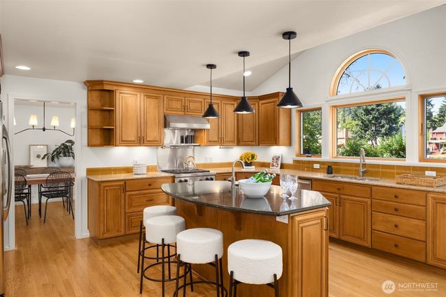 Start your day at the kitchen bar, where morning coffee and casual bites come with sunshine and river breezes. | Image 5