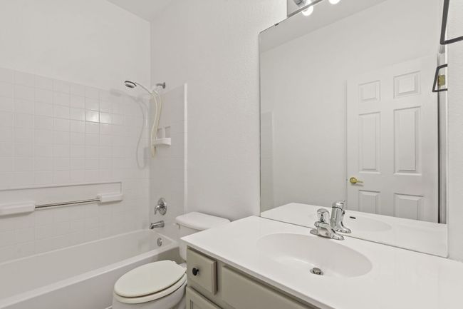 Full bathroom with toilet, vanity, and bathing tub / shower combination | Image 30