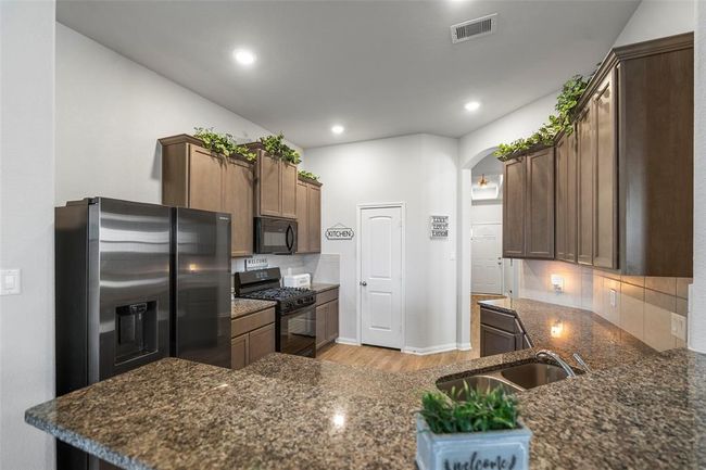 Nice, open kitchen with plenty of counter space. | Image 13