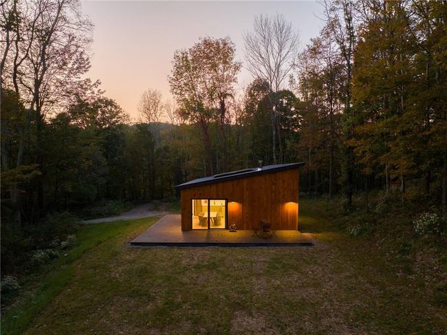 Back house at dusk with a yard | Image 17