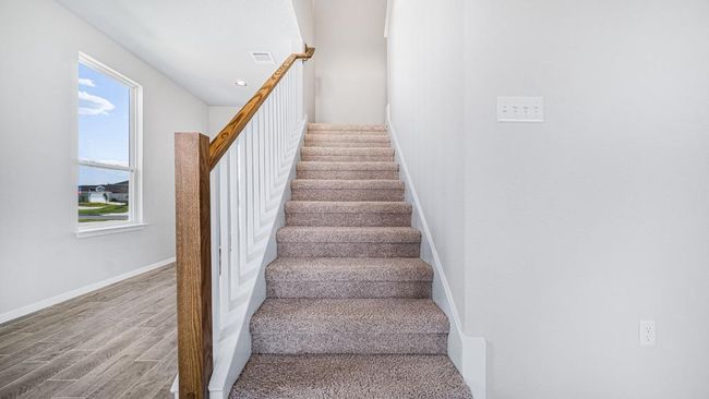 Stairway with wood finished floors and recessed lighting | Image 10