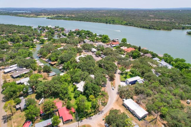 Aerial view of property's location featuring a large body of water and a forest | Image 9