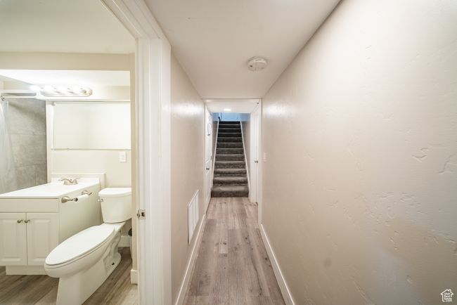 Bathroom with wood finished floors and vanity | Image 18