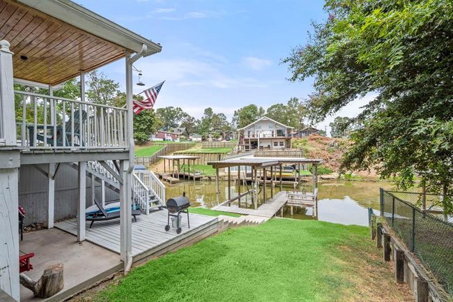 View of yard, deck and boat dock | Image 6