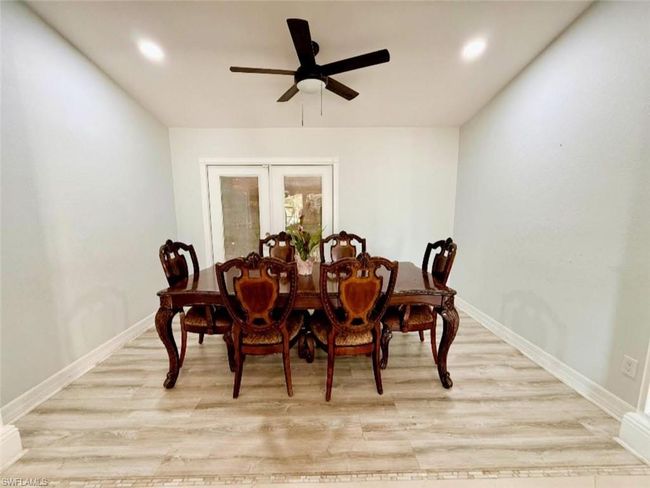 Dining area with wood finished floors, french doors, a ceiling fan, and recessed lighting | Image 10