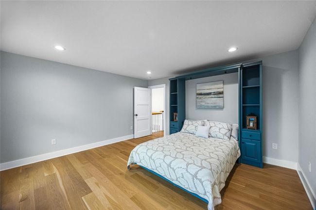 Bedroom with baseboards, wood finished floors, and recessed lighting | Image 34