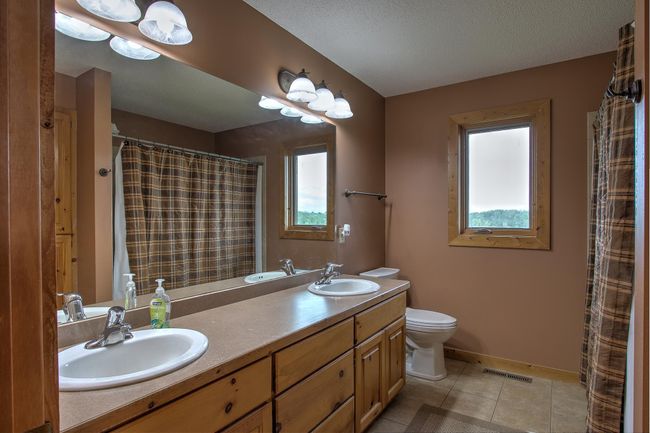 Main level bath with large linen closet and oversize tub. | Image 18