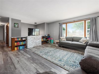 Living room with hardwood / wood-style flooring | Image 3