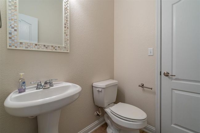 Bathroom featuring toilet and a sink | Image 19