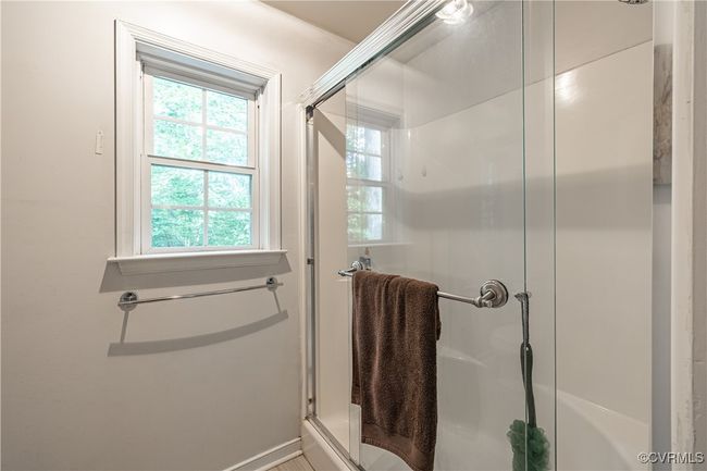 Bathroom with a stall shower and baseboards | Image 19