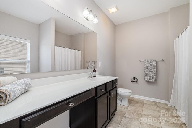 En Suite main floor bath has a vast amount of room for guests or multi-generational living. | Image 19