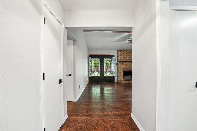 Corridor featuring french doors and parquet floors | Image 4