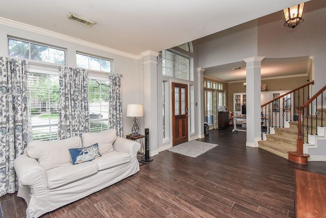 Your formal living room offers a warm and inviting space to welcome guests, featuring elegant finishes, abundant natural light, and plenty of room to showcase your personal style and favorite decor. | Image 18