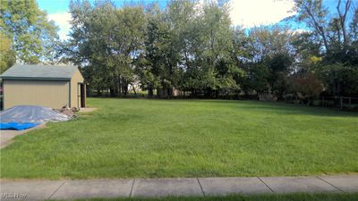 View of yard featuring a storage unit | Image 3