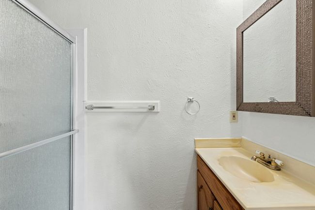 Full bath with vanity and a shower with door | Image 13