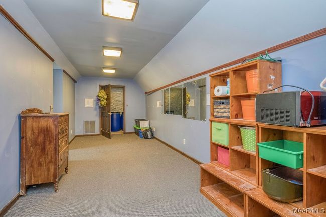 There are stairs down to the garage and the level 3 entrance is from an upstairs bedroom closet and attic storage that is foam insulated. A hidden jewel! | Image 71