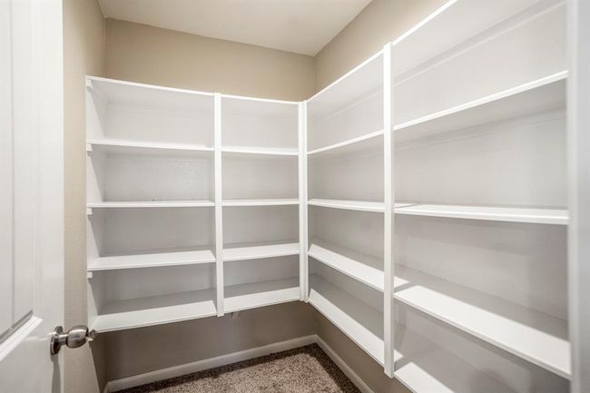One of the biggest PLUS in this home is this HUGE walk-in closet. | Image 28