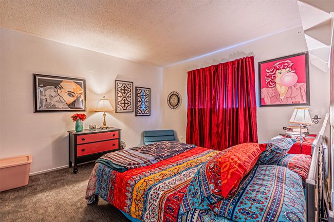 Bedroom featuring carpet and a textured ceiling | Image 16