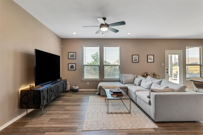 Living room featuring ceiling fan, wood finished floors, and recessed lighting | Image 5