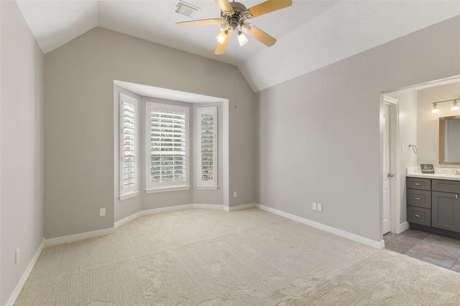 Large bedroom with high ceilings connected to a Jack and Jill bath. | Image 36