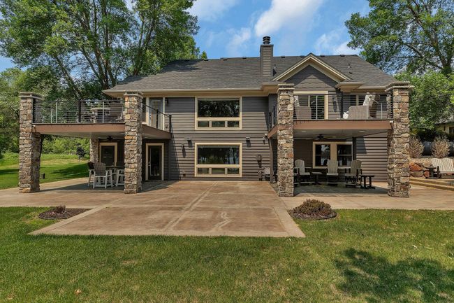 Beautiful outdoor space with maintenance-free deck and stamped concrete patio. | Image 36