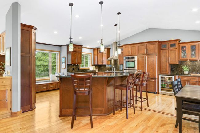 Enjoy easy entertainment with the open concept kitchen that flows into the dining room. | Image 7