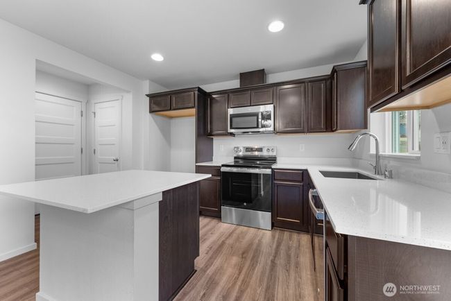 Photographs are for illustrative purposes only. Features, finishes, interior/exterior colors, landscaping and floorplan shown may vary from actual homes built. | Image 10