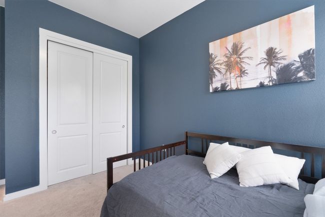 Carpeted bedroom featuring a closet and baseboards | Image 32