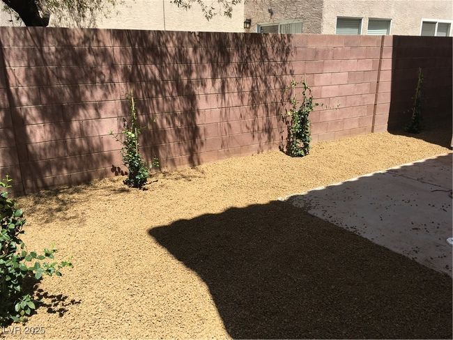 View of yard with fence | Image 30