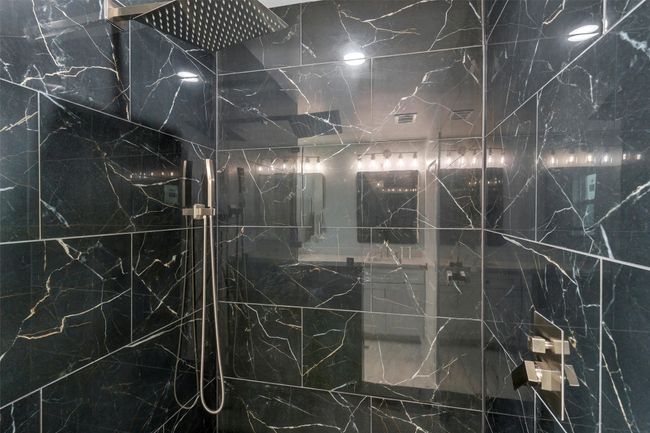 Bathroom view of a marble finish shower | Image 30