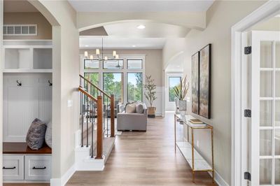 Beautiful entry with large mud room access from front door and garage. | Image 2