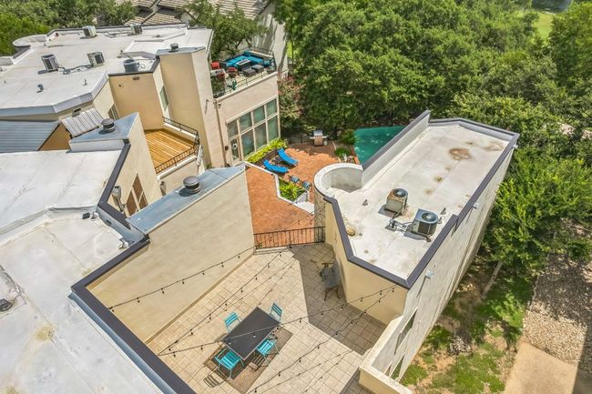 Aerial view of outdoor dining space and pool | Image 30