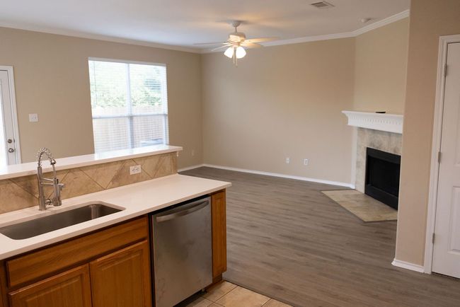 View of living room with new laminate floors from the kitchen | Image 8