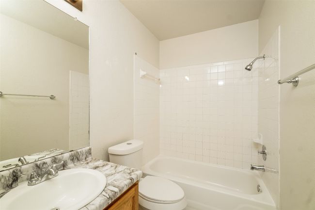 Full bathroom featuring vanity and shower / bath combination | Image 14