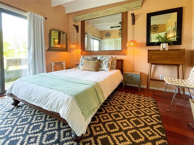 Bedroom with access to exterior, multiple windows, and wood finished floors | Image 11