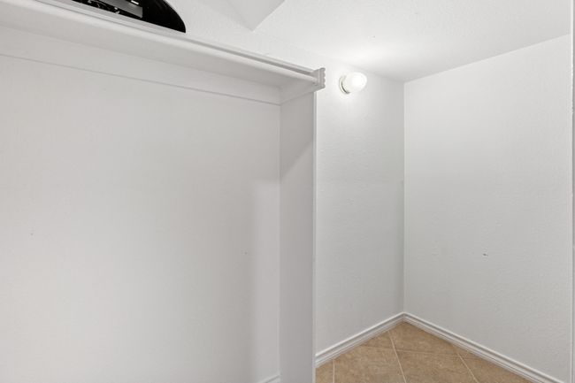 Spacious closet featuring light tile patterned floors | Image 20