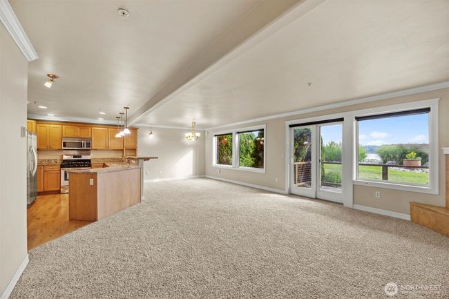 Windows are tinted to keep room comfortable and also have shades. Spacious, open living space. | Image 6