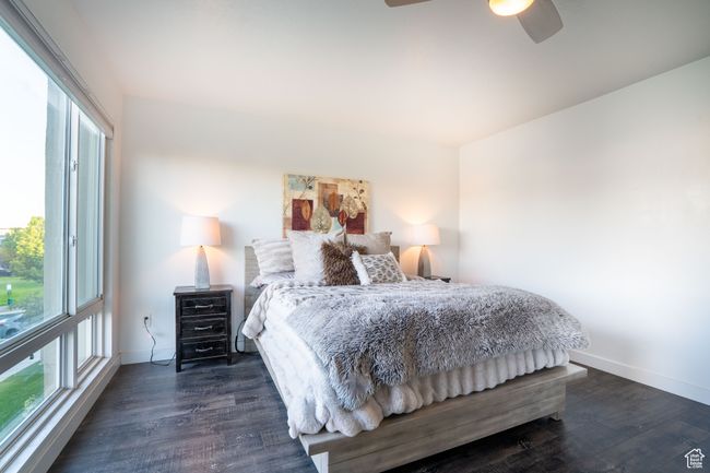 Bedroom featuring wood finished floors and ceiling fan | Image 18