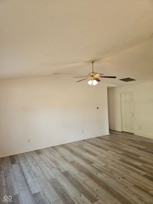 Catherdral ceilings in expansive living room | Image 6
