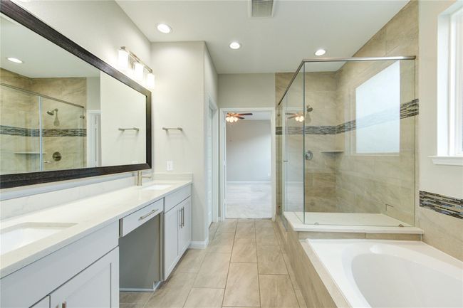 Primary bathroom, large walk in shower and seperate tub | Image 26